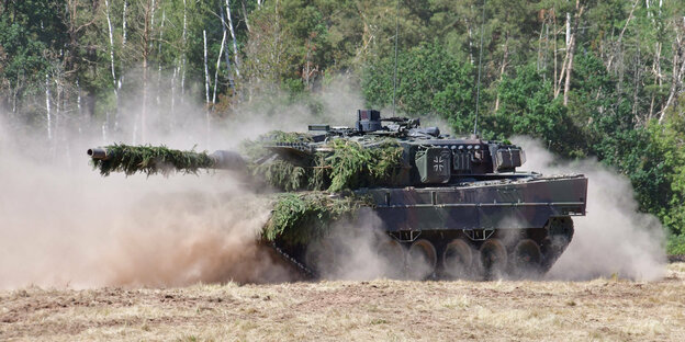 Panzer rolls over a field