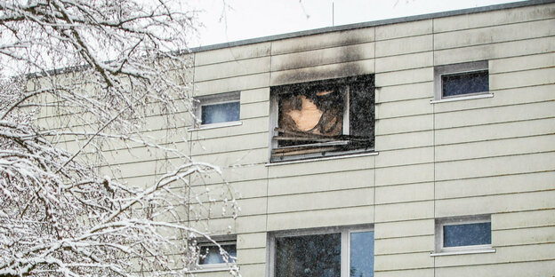 Window in a residential building after a fire