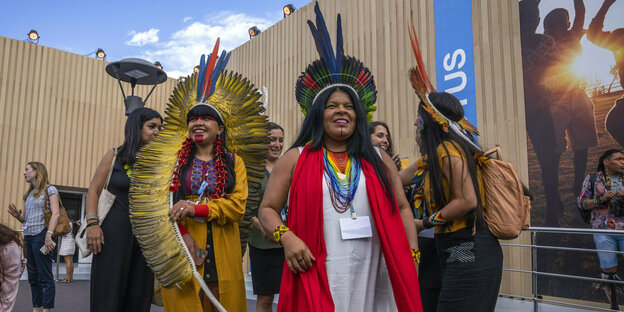 Indigenous activist, environmentalist and politician Sonia Guajajara from Brazil wears a feather headdress