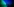 Eine Gruppe schwarzgekleideter Menschen neigt sich im Gehen leicht zur linken Seite. Die Lichterkulisse ist blau und grün.