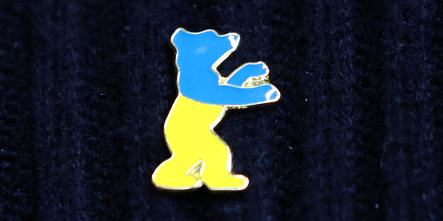 The Berlinale Bear as a badge in the Ukrainian national colors of blue and yellow
