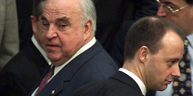 Helmut Kohl and Friedrich Merz pass each other