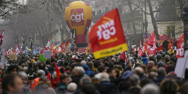 Protests in Paris with placards and union flags