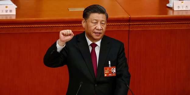 Xi Jinping raises his fist