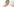 Eine junge Frau schaut lächelnd in die Kamera, sie trägt einen türkisfarbenen Turban