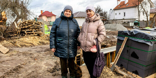 Two women at a construction site