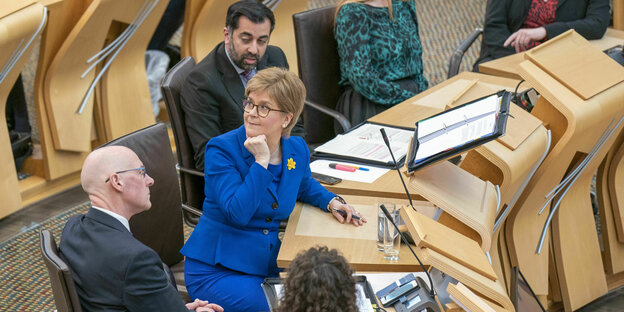 Nicola Sturgeon (M), outgoing Prime Minister of Scotland, after her final Question Time in the Chamber of the Scottish Parliament.