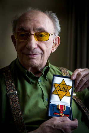 Walter Frankstein shows the Star of David, which he had to wear and kept.  and the Federal Cross of Merit which was awarded to him