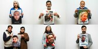 Angehörige der Opfer zeigen Fotos ihrer ermordeten Angehörigen oder Kinder