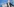 Der regierende Bürgermeister kai Wegner sitzt vor blauem Hintergrund in einer Pressekonferenz. Vor ihm sind vier Aktenordner aufgereit.