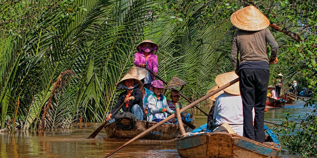 Reisende auf dem Mekong