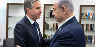 Antony Blinken und Benjamin Netanjahu stehen sich gegenüber