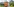 Alexander und Mischa Zverev am Tennisnetz. Im Hintergrund Bergpanorama