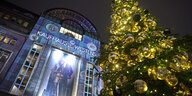A Christmas tree is set up in front of the department store Kaufhaus des Westens "KaDeWe" in Berlin