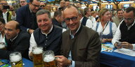 Merz im Bayerischen Bierzelt mit Seidel in der Hand