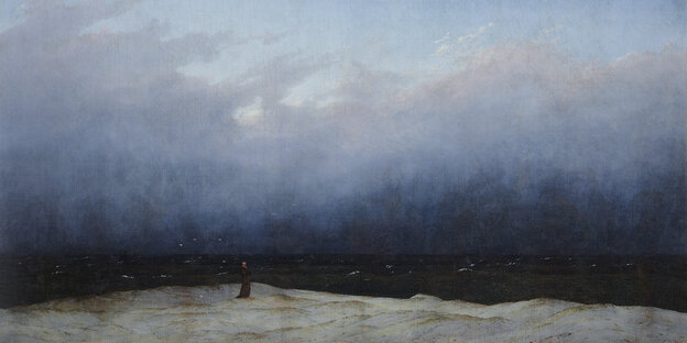 Bild von Caspar David Friedrich: Der Mönch am Meer. Darauf zu sehen: Ein Mann steht am Strand an einem Meer, er wirkt vor der Natur sehr klein