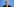 Wirtschaftswissenschaftlerin Veronika Grimm spricht auf einer Pressekonferenz vor einer blauen Wand