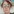 Frau mit großer Brille und rötlichen Locken