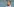 Leonie Meyer, eine Frau mit blonden langen Haaren, in einer Portraitaufnahme. Sie schaut nach links aus dem Bild raus.