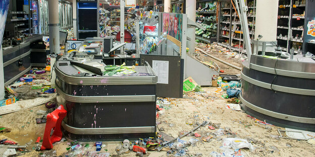 A completely destroyed checkout area in a supermarket