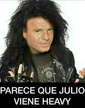 Julio Iglesias with black, long hair and in metal clothes and the metal hand gesture. Below is the text: 