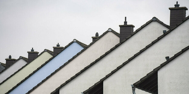 Roofs of terraced houses lined up in a row