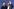 Johannes Winkel und Carsten Linnemann stehen nebeneinander. Linnemann winkt mit seiner linken Hand