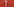 Beine einer Schaufensterpuppe vor roter Wand