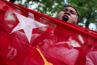 FILE PHOTO: A protester holds a flag as he shouts slogans during a demonstration to mark the third anniversary of Myanmar’s 2021 military coup, outside of the United Nations office in Bangkok, Thailand, February 1, 2024. REUTERS/Chalinee Thirasupa/File Photo