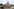 Das Bild zeigt eine Dresdner Ansicht mit Frauenkirche und eingestürzter Carolabrücke.