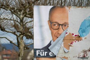 Ein abgerissenes Plakat mit Friedrich Merz als Bild.