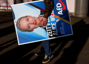 A person holds a placard with an image of Alternative for Germany party (AfD) top candidate Alice Weidel, on the day of an AfD campaign rally in Hohenschoenhausen, Berlin, Germany, February 22, 2025. REUTERS/Christian Mang