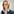 Portrait einer Frau mit blonden, halblangen Haaren, Brille, einer hellblauen Bluse und einem Blazer.