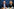 Friedrich Merz und Karin Prien sitzen lächelnd nebeneinander