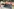 Blumen, Kerzen, Stofftiere und ein Banner "Trauer aus Liebe nicht aus Hass" am Tatort in Aschaffenburg