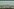 Pferde laufen am Horizont einer Steppenlandschaft