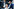 Zu sehen ist die rechtsextreme AfD-Chefin Alice Weidel, im Hintergrund die Köpfe der neuen Bundesregierung Lars Klingbeil und Friedrich Merz.