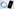 Blauer Ring (Logo) neben Smartphone