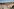 Blick auf ein Gebäudekomplex, im Hintergrund Wohnhäuser