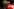 Fan im FC Bayern-Trikot betrachtet die Trophäe, die der Sieger der Klub-WM erhalten wird