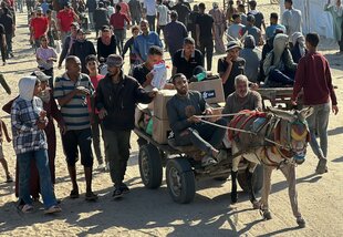 Palästinenser in der Nähe einer Hilfsgüterverteilungsstelle der Gaza Humanitarian Foundation (GHF) in Rafah im Gazastreifen.