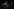Frauen mit roten Masekn und nackten Pberkörpern tanzen in Jogginghosen auf einer Bühne mit Baugerüst