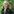 Charlotte Krawczyk mit Hemd vor einem Gebüsch
