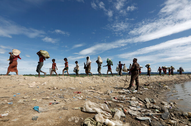 Rohingya refugees who crossed the border from Myanmar on their way after receiving permission from the Bangladeshi police to proceed to the refugee camps in Palang Khali near Cox's Bazar in Bangladesh.