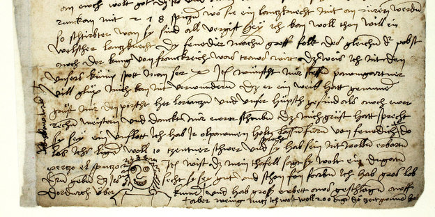 Brief von Dürer, in den er ein Grinsegesicht gekritzelt hat