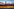 Ein riesiges Banner in Deutschlandfarben verdeckt halb eine Stadtsilhouette Ein riesiges Banner in Deutschlandfarben verdeckt halb eine Stadtsilhouette