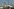 Sicherheitsbeamte auf dem Oktoberfest, im Hintergrund ist ein Riesenrad zu sehen