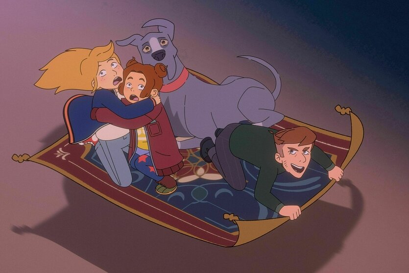 Ausschnitt aus der Zeichentrickserie. Zwei Mädchen sitzen hinten auf einem fliegenden Teppich und umklammern einander. neben ihnen ein großer grauer Hund, der stark an eine Dogge erinnert. Vorne ein junger Mann, der den Teppich lenkt und freudig lacht.