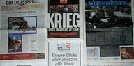 Mehrere Titelseiten von deutschen Zeitungen liegen nebeneinander