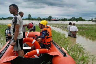Nepalese army personnel get ready to rescue survivors after a flood in Jhapa district east of Nepal, Sunday, Oct. 5, 2025.